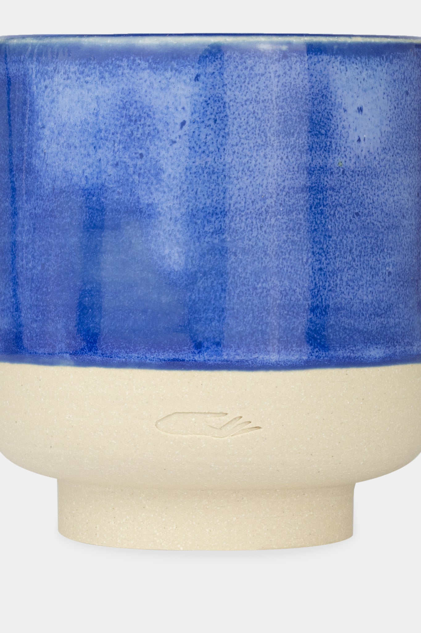 Provide blue glazed ceramic candle with hand logo imprint (close up)