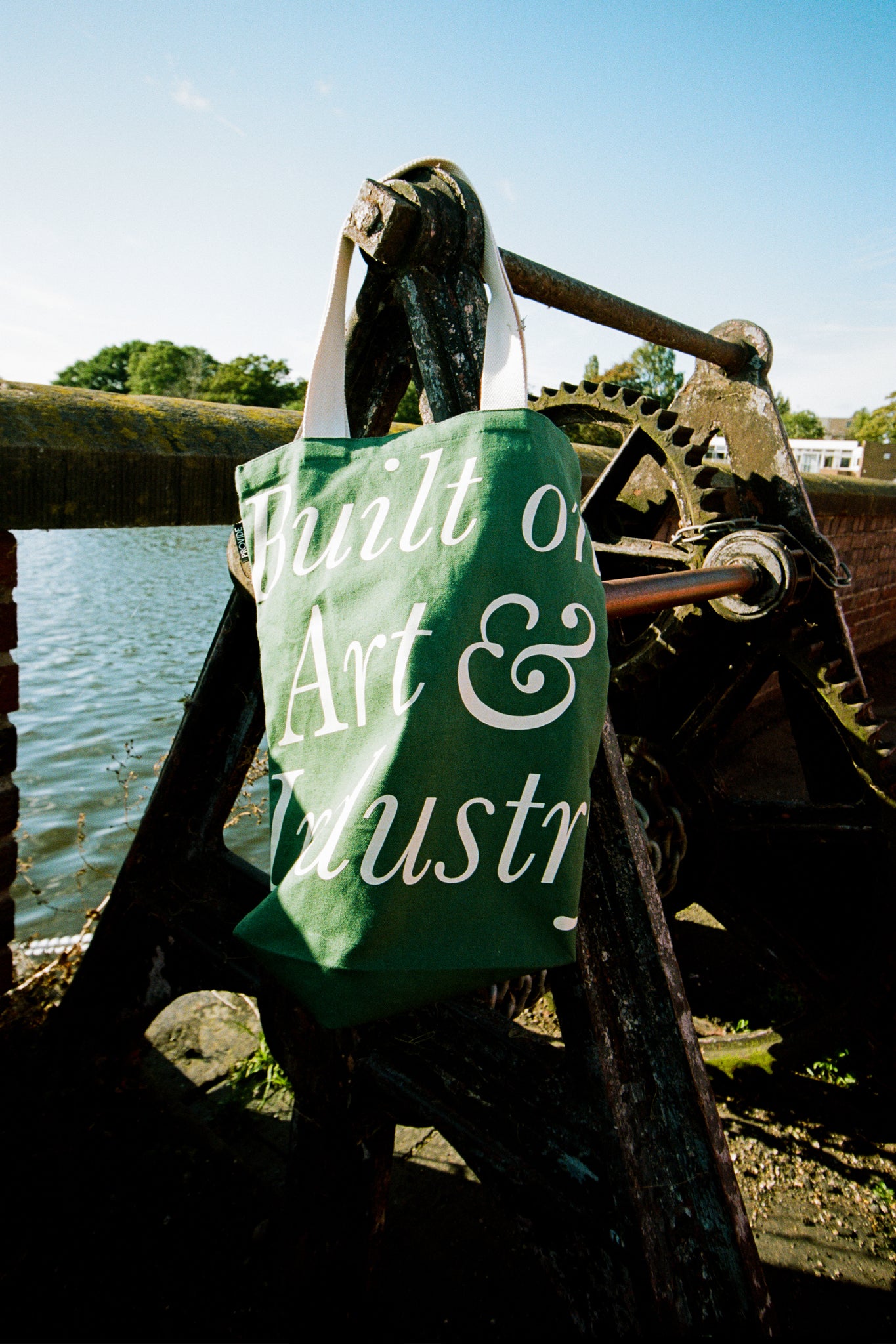 Provide Built on Art and Industry green Tote Bag with hand logo (front)