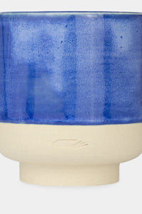 Details of Provide blue glazed ceramic cup with hand logo imprint