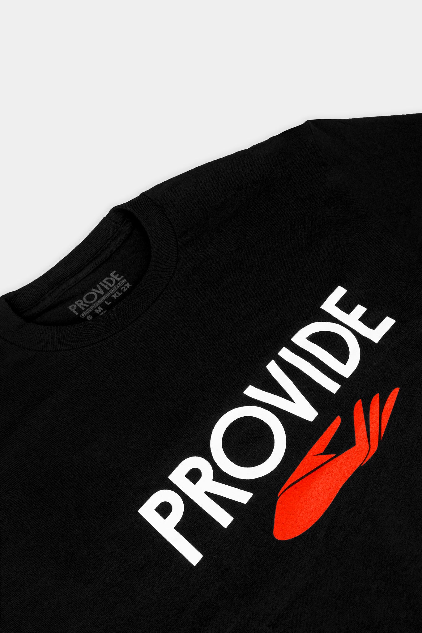 Provide black tee with large chest print of wordmark and red hand logo (close up)